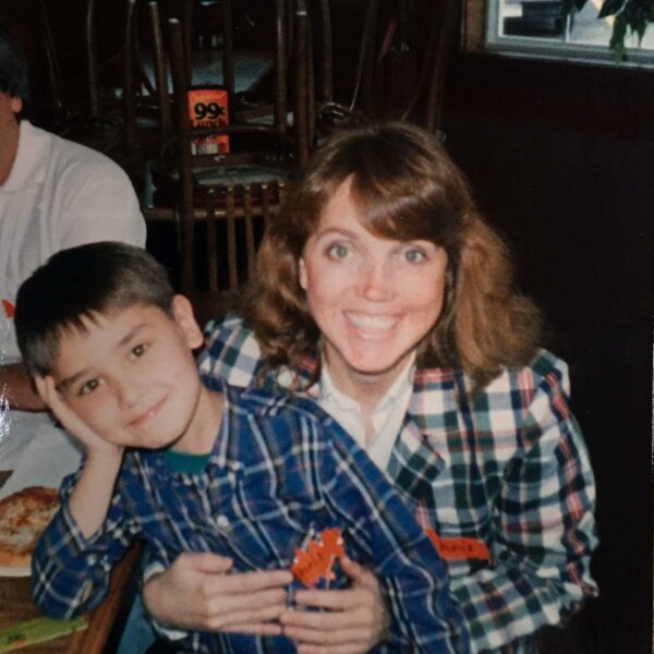Christine holds her son, Christopher, when he was much younger