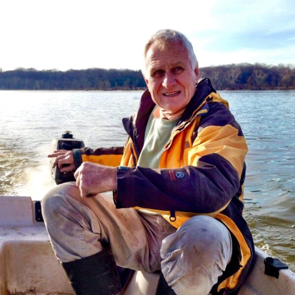 Johan steers the rudder of his boat