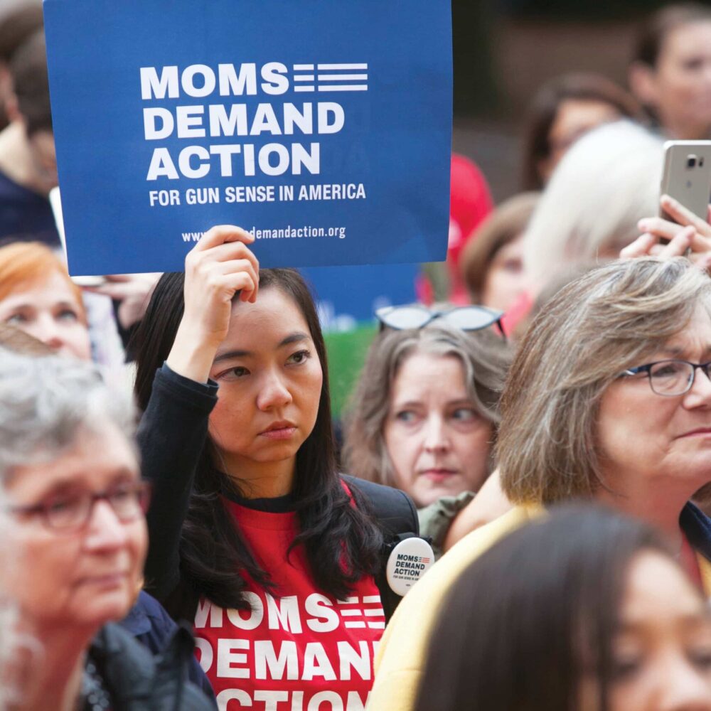 Woman holding a sign at an advocacy day in Texas