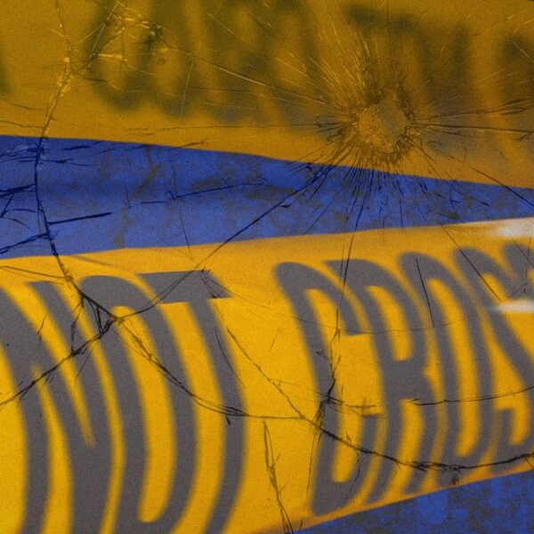 Yellow crime scene caution tape that reads 