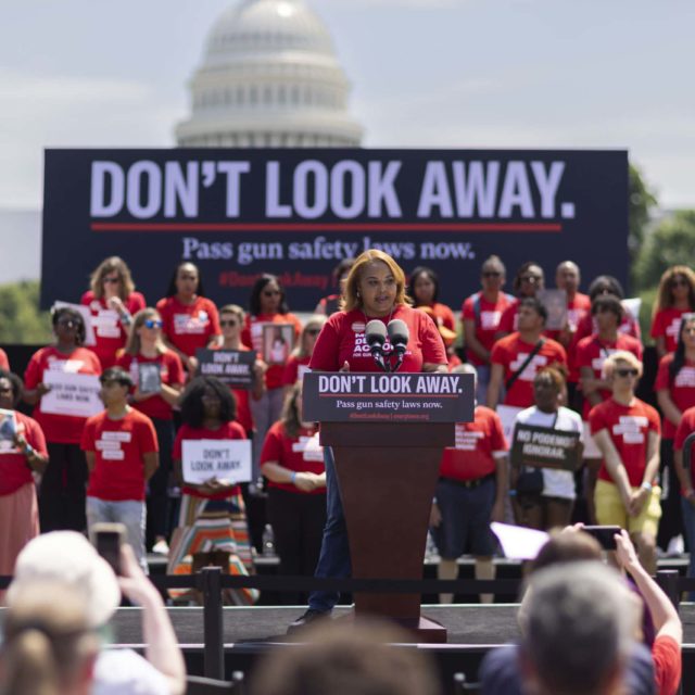 Moms Demand Action volunteer Melody McFadden speaks at the podium at a Don't Look Away rally in Washington, DC in 2022