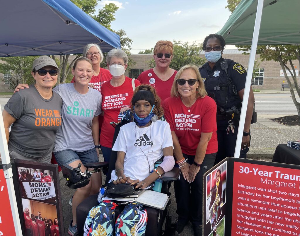 Michele Mueller and a group of 7 other volunteers wearing Moms Demand Action shirts